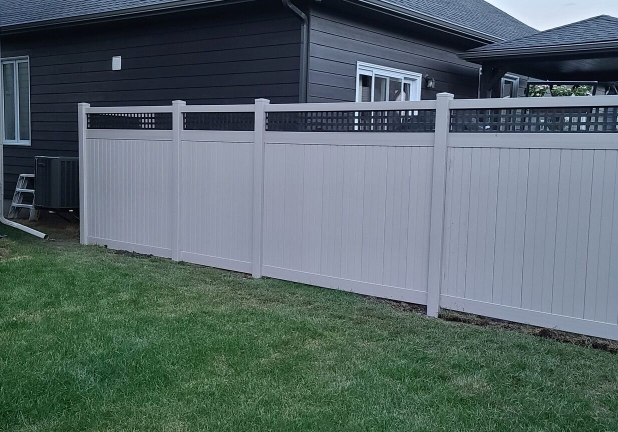 20200824_195248 Gray fence between two houses in backyard.